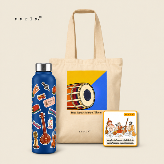 For the Rasika Diwali gift hamper: 1 Carnatic stainless steel water bottle — 900 ml; 1 Mridangam canvas tote; 1 Carnatic Trinity fridge magnet — 2.5 × 2.5 inches