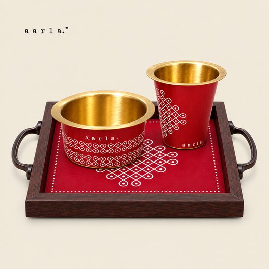 Kolam & Kaapi Diwali gift hamper: 1 Red Kolam brass dabara-tumbler set — one tumbler and one dabara; 1 Small Red Kolam tray — 6 × 6 inches